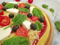 Pizza, tomatoes, olives mediterranean traditional on concrete background preparation