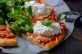 Pizza with tomatoes and strachatella cheese Royalty Free Stock Photo