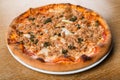 Pizza tonno e cipolla: this traditional pizza variety is topped with tomato sauce, mozzarella, tuna