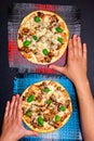 Pizza top view of a man hands. vertical photo Royalty Free Stock Photo