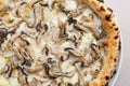 Pizza with truffle mushrooms close-up