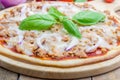 Pizza with tuna fish on a wooden board Royalty Free Stock Photo