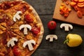 Pizza and vegetables on a table top