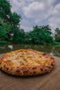Pizza on wood. Shrimp Pizza. Pizza background image placed on a wooden floor