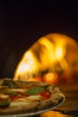 Pizza on wood burning fire oven Royalty Free Stock Photo