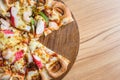 Pizza on wooden plate on top table background Royalty Free Stock Photo