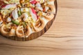 Pizza on wooden plate on top table background Royalty Free Stock Photo