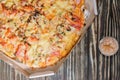 Pizza on a wooden table and toothpicks Royalty Free Stock Photo