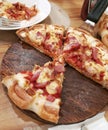 Pizza on the wooden tray.