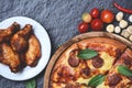 Pizza on wooden tray top view / delicious tasty fast food italian traditional and baked chicken wing bbq grill Royalty Free Stock Photo