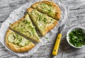 Pizza with zucchini, onion, cheese and sesame seeds