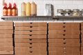 Pizzas cardboard boxes for shipping and delivery. a lot of packaging is on the kitchen stock