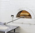 Pizzas or pita bread baking in an open firewood oven Royalty Free Stock Photo