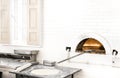 Pizzas or pita bread baking in an open firewood oven Royalty Free Stock Photo