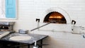 Pizzas or pita bread baking in an open firewood oven Royalty Free Stock Photo