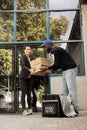 Pizzeria deliveryman passing client pizza boxes huge stack Royalty Free Stock Photo