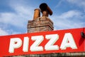 Pizzeria restaurant sign pizza text on wall facade italian style restaurant