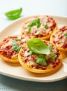 Pizzette with tomatoes and basil Royalty Free Stock Photo