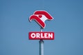 PKN Orlen logo with a blue sky background Royalty Free Stock Photo