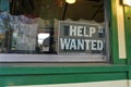 Help Wanted sign in window of small business Royalty Free Stock Photo