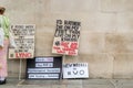 Placards stood along a wall at the Unite for Freedom rally; thousands gathered in Trafalgar Square