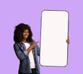 Place For Ad. Smiling Black Lady Holding And Pointing At Blank Smartphone Royalty Free Stock Photo