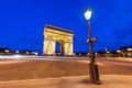 Place Charles de Gaulle at night with illuminated Arc de Triomph