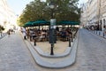 Place Dauphine in Paris with Parisians resting, benches and planted chestnuts, to which bicycles are parked Royalty Free Stock Photo