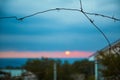 Place of detention. Prison. Jail. Sunset view from protected location. Barbed wire. Stop sign. Blue sky. Dangerous area Royalty Free Stock Photo