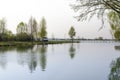 A place for meditation-wooden gazebo stands on the shore of the Lake near the young trees