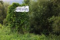 White sign on the side of the road with the name of the locality, Suncuius. Bihor county, Romania, Europe