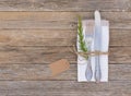 Place setting with cutlery and napkin on wooden table background Royalty Free Stock Photo