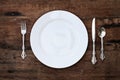 Place setting of a dining set over rustic background Royalty Free Stock Photo