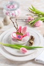 Place setting for Easter table with spring flowers Royalty Free Stock Photo