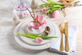 Place setting for Easter table with spring flowers Royalty Free Stock Photo