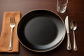 Place setting an empty plate with knife, fork, and spoon Royalty Free Stock Photo