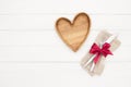 Place Setting. Empty wooden plate, fork and knife on white background.Wooden plate heart shape.Love food, love eating, romantic