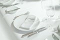 Place setting for one person. Knife, square glass plate and fork