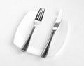 Place setting for one person: knife, square white