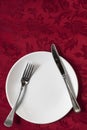 Place Setting on Red Brocade Tablecloth Royalty Free Stock Photo