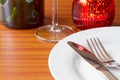 Place setting with red candle