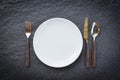 Place setting table food with set of white plate on table cloths or napkin on the dinner / empty plate spoon fork and knife on Royalty Free Stock Photo