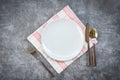 Place setting table food with set of white plate on table cloths or napkin on the dinner / empty plate spoon fork and knife on Royalty Free Stock Photo