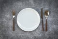 Place setting table food with set of white plate on table cloths or napkin on the dinner / empty plate spoon fork and knife on Royalty Free Stock Photo