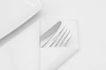 Place setting, white plate with cutlery