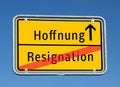 Place sign hope / resignation in german