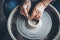 Place to work. Top view potter making ceramic pot on the pottery wheel