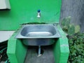 Place for washing hands in the open space between the plants