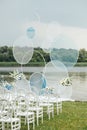Place for wedding ceremony on river beach outdoors. Large installation of round arch Royalty Free Stock Photo