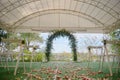 Place for wedding ceremony in tent outdoors, copy space. Wedding arch decorated with flowers and chairs. Royalty Free Stock Photo
